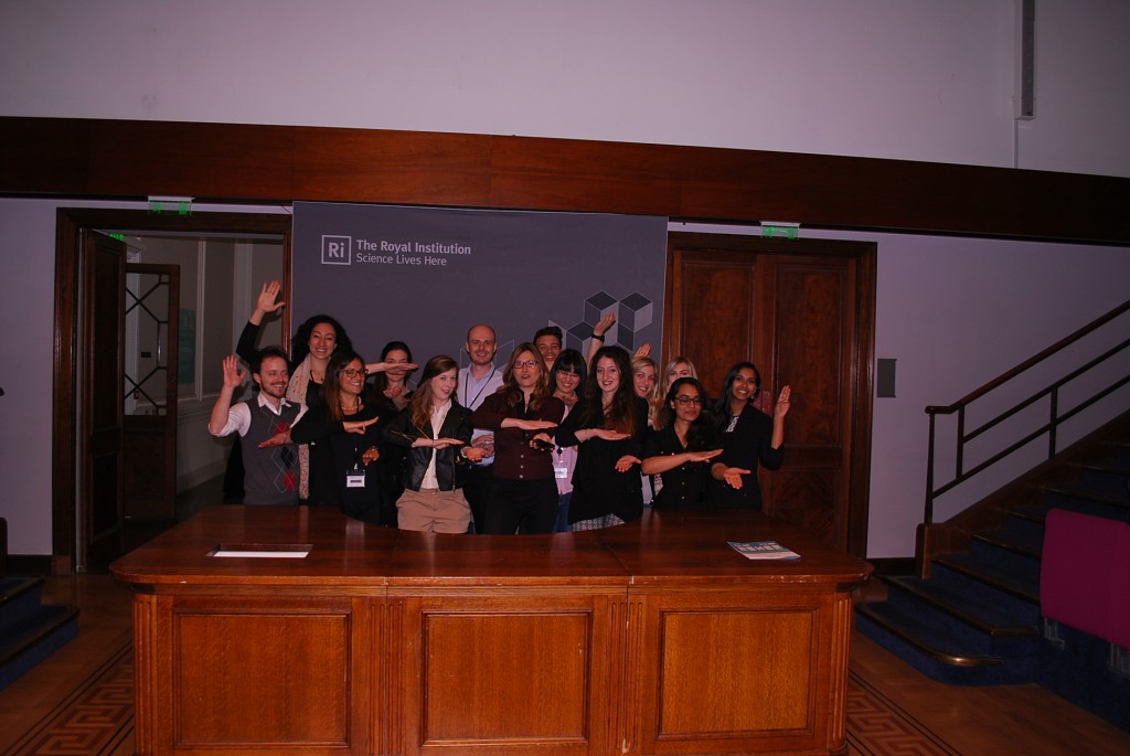 The team demonstrating the social softness illusion in the famous Royal Institute lecture theatre